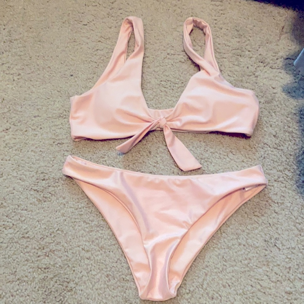 Pink bathing suit. Bottoms have never been worn.